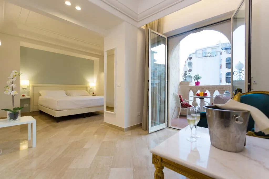 Suite luminosa con letto, terrazzo e spumante